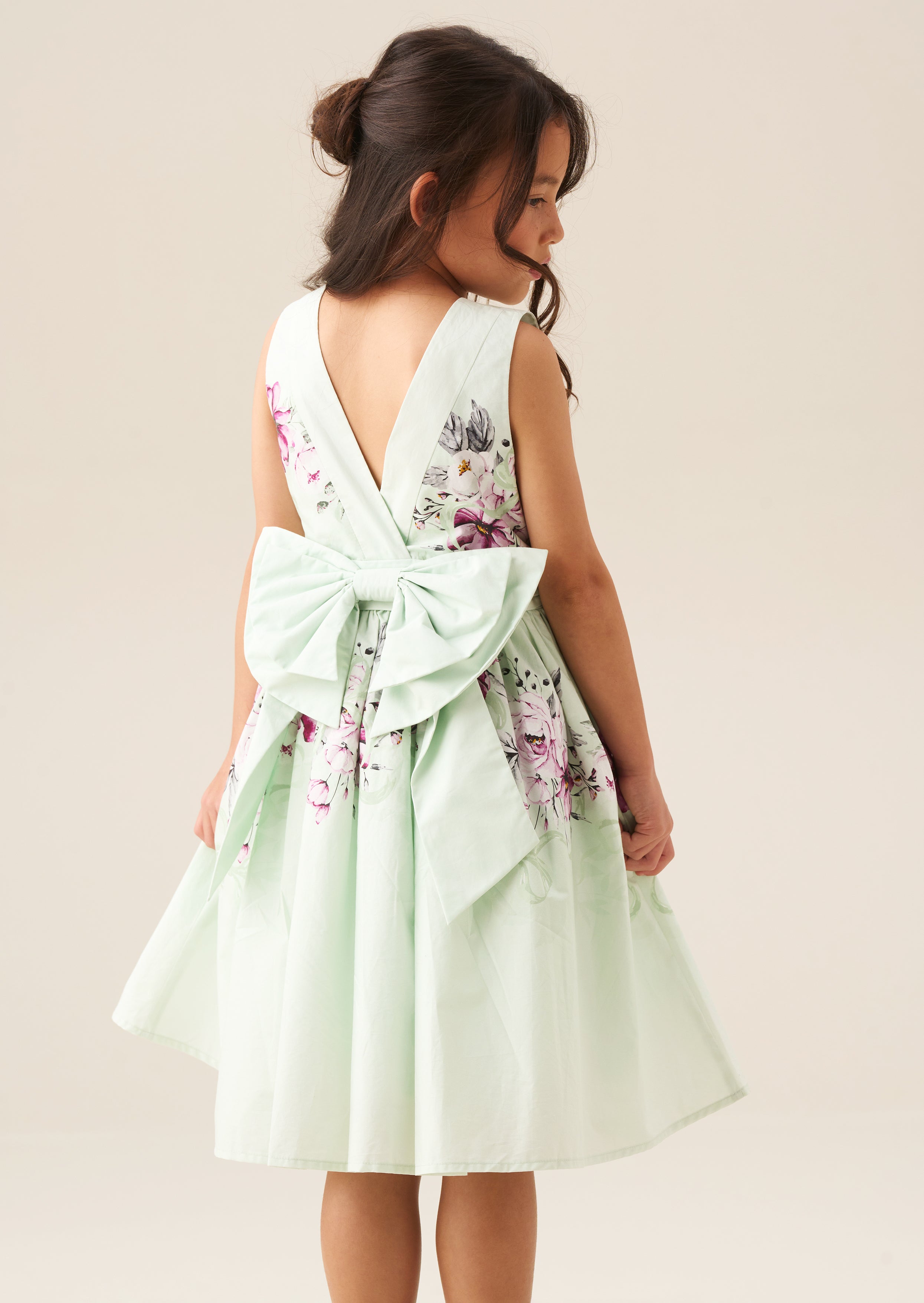 Sukienka z kokardą na plecach w miętowy wzór Elisa