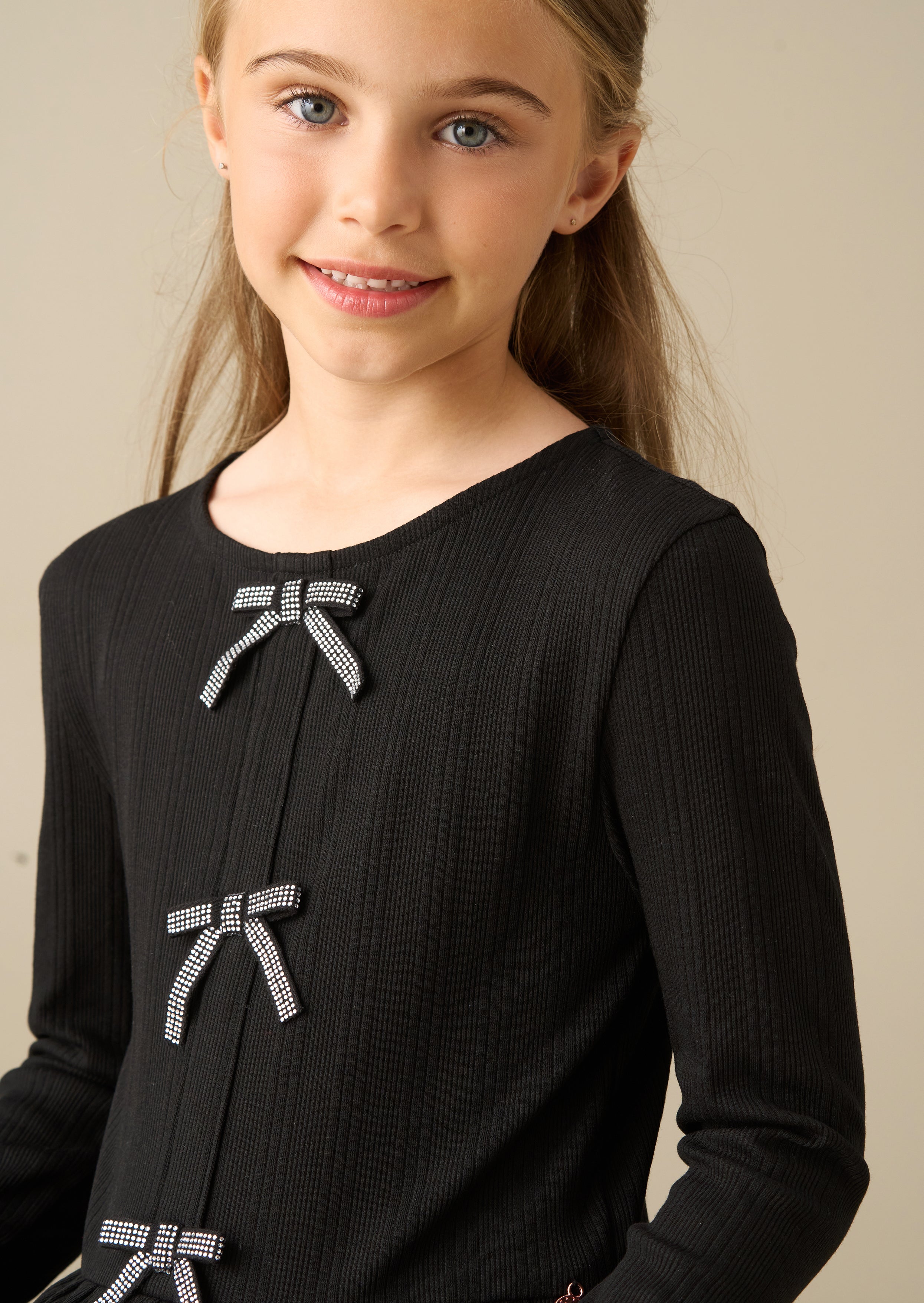 Rona Black Peplum Long Sleeve Bow Top