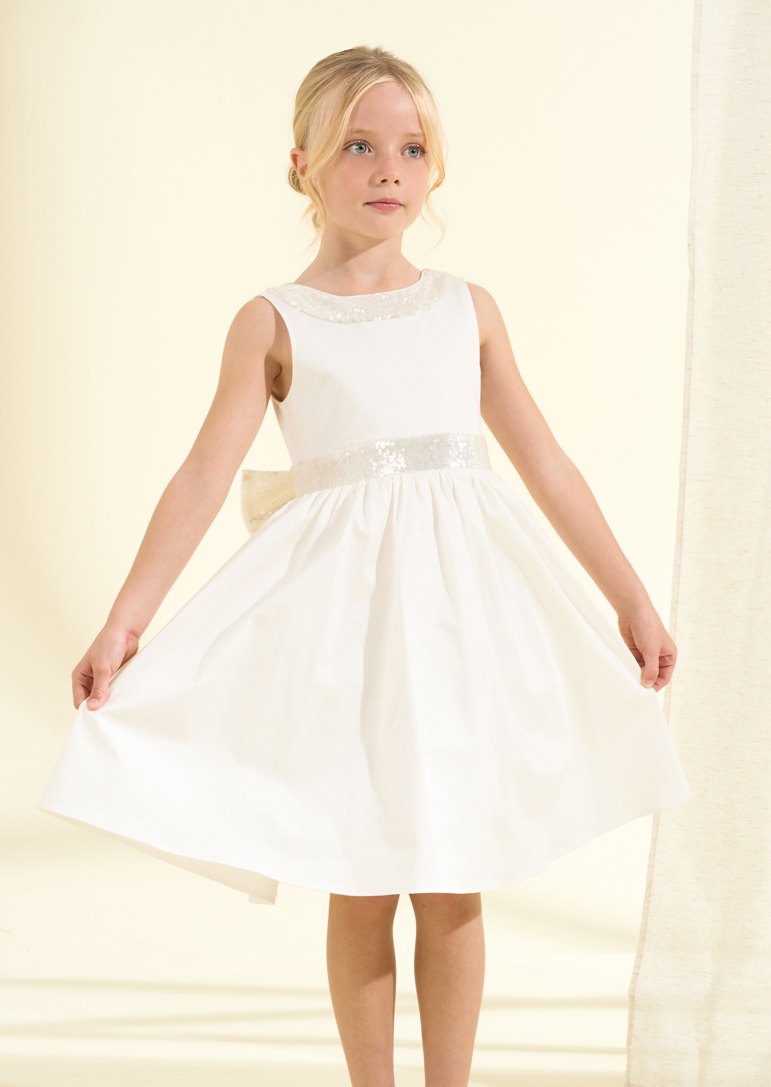 Vestito Claudia avorio con fiocco di paillettes