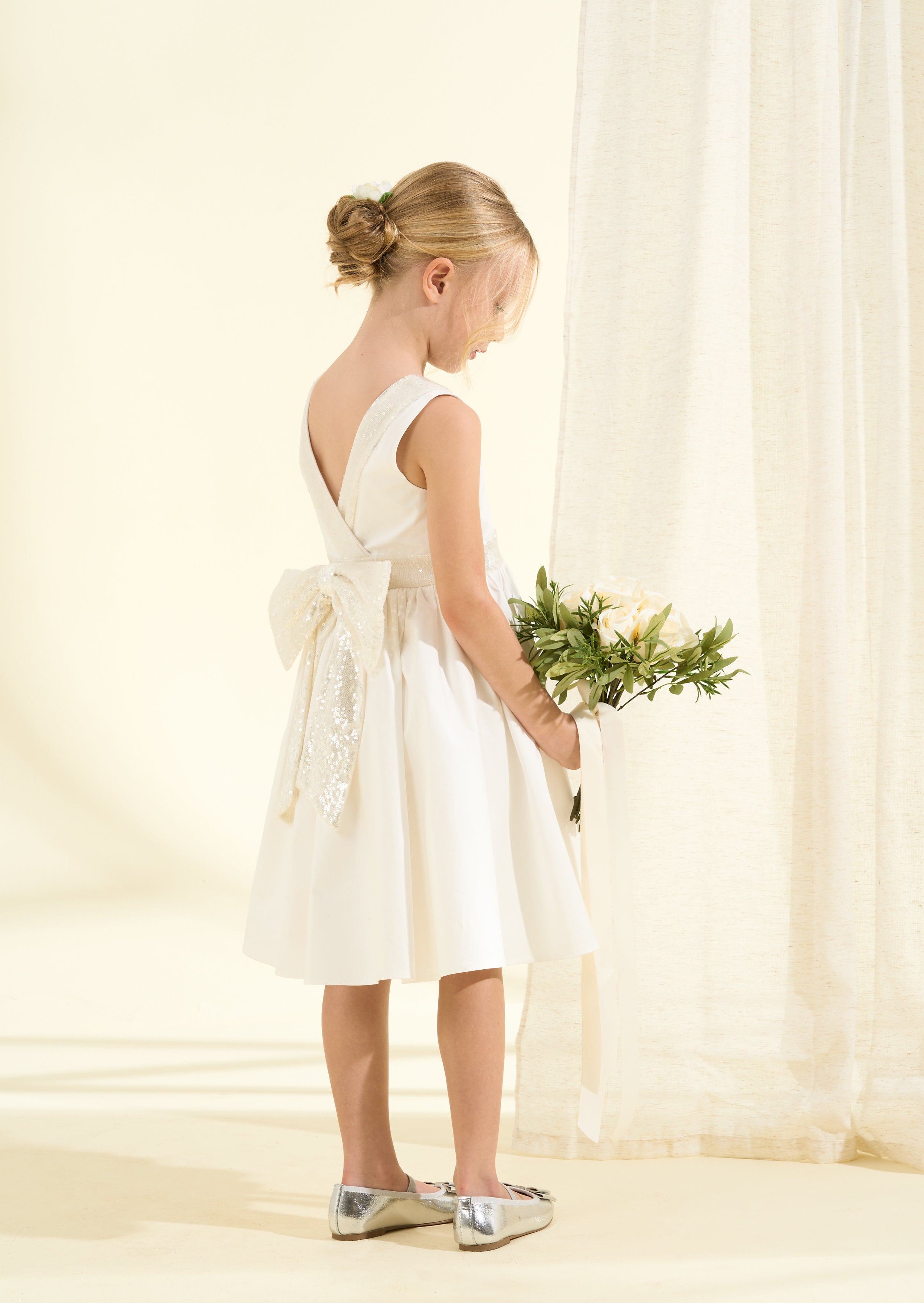 Vestito Claudia avorio con fiocco di paillettes