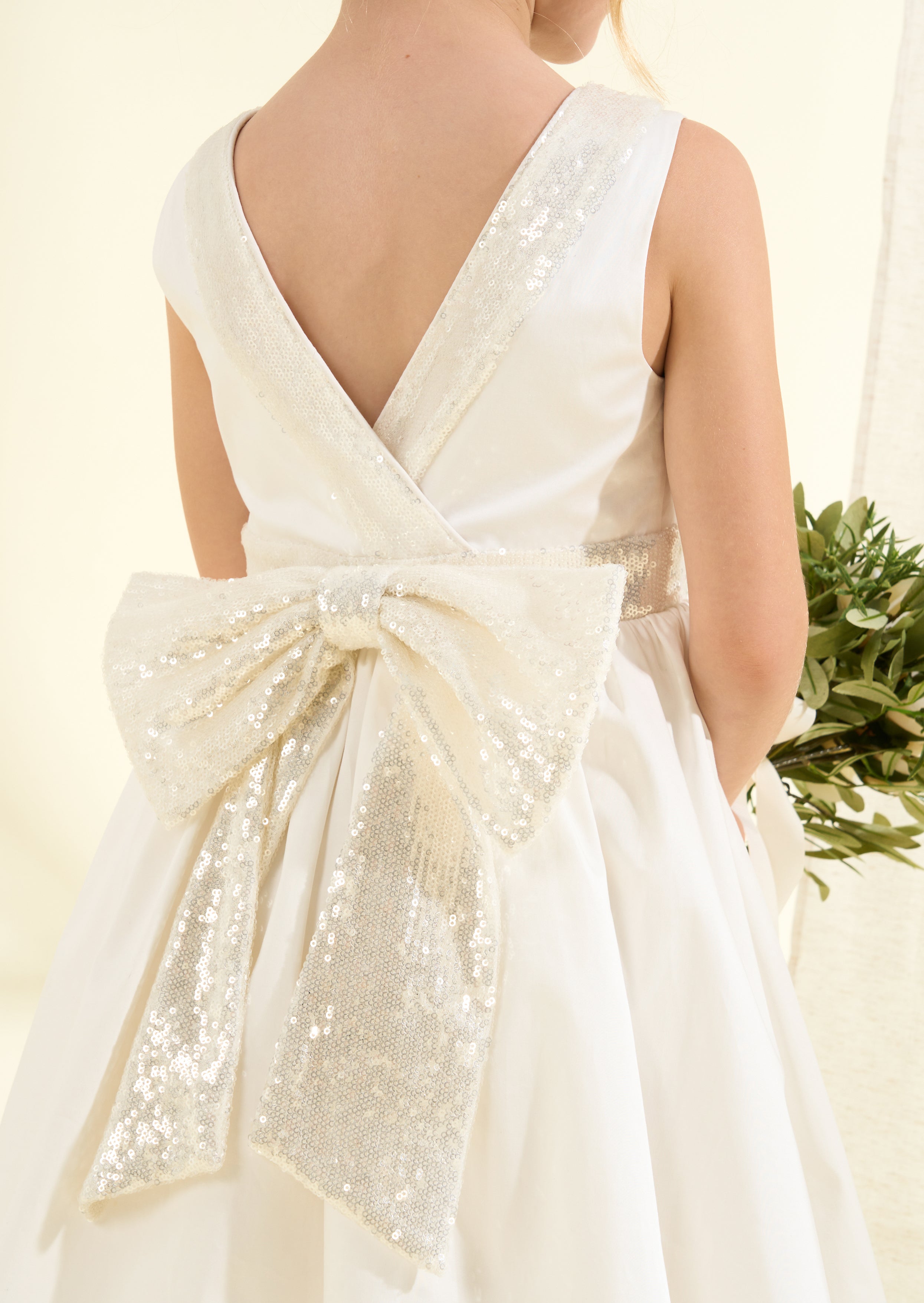 Vestito Claudia avorio con fiocco di paillettes