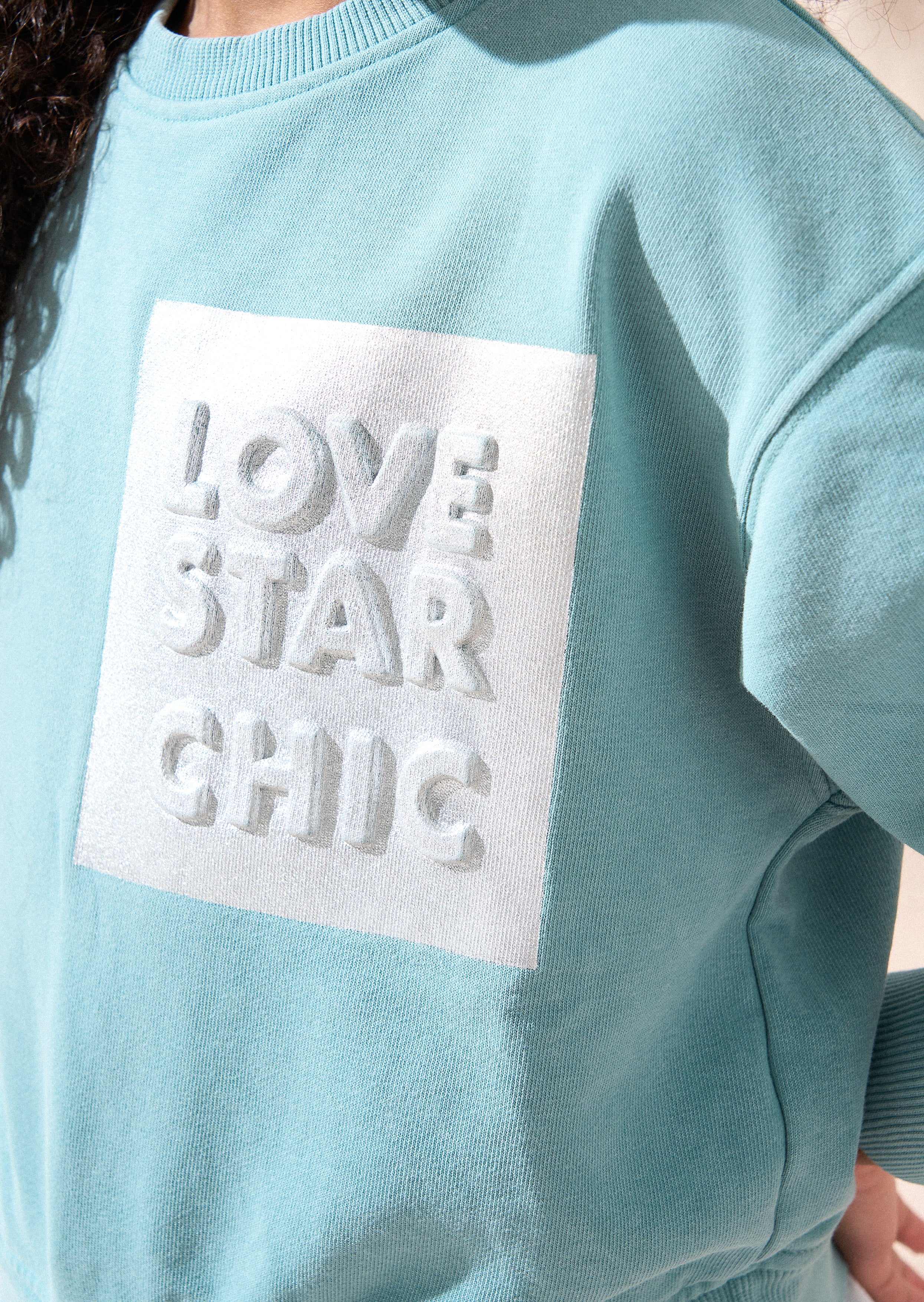 Eloise grünes Sweatshirt mit Hemdsaum