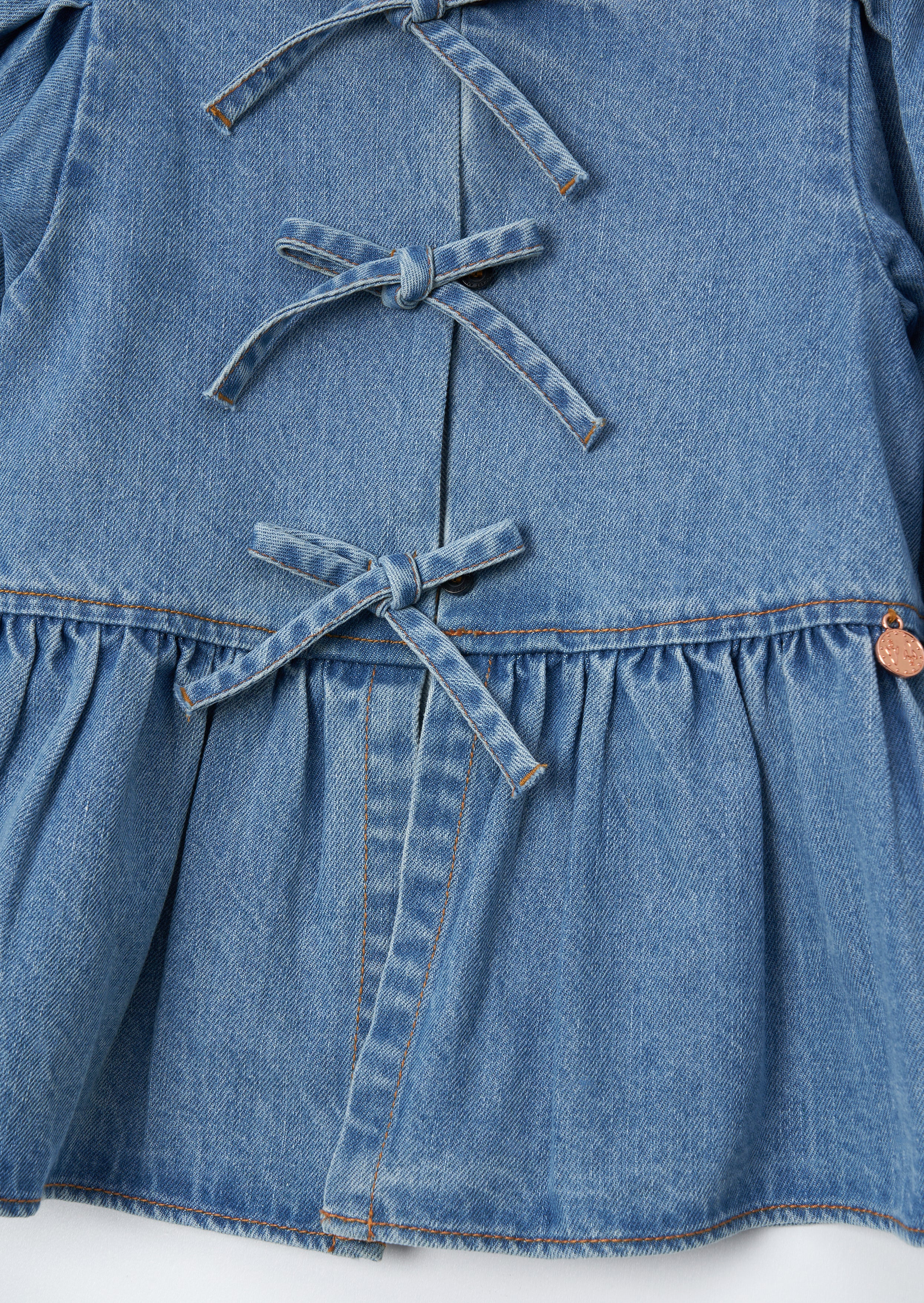 Top de lazo peplum de mezclilla azul Rochelle
