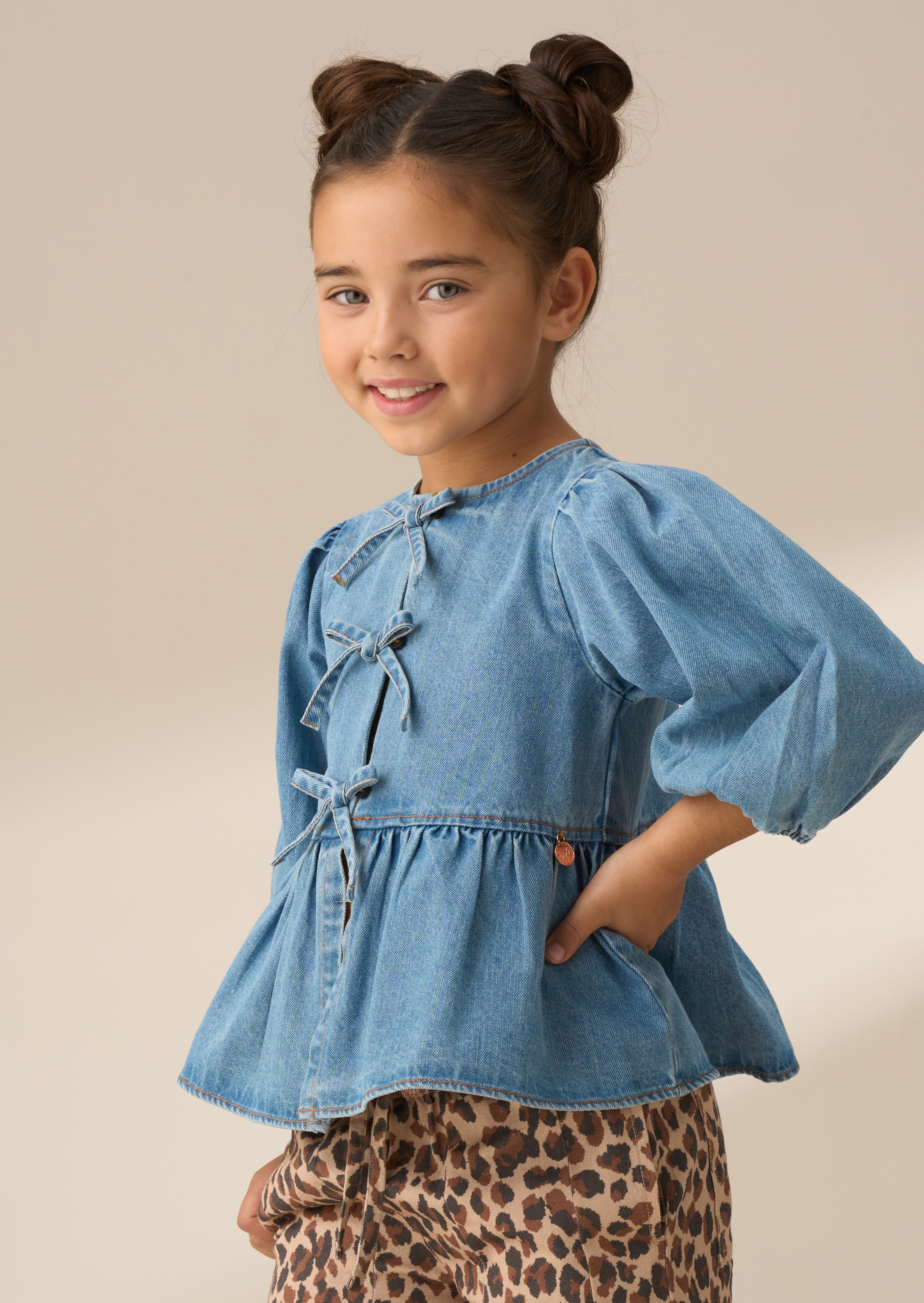 Top de lazo peplum de mezclilla azul Rochelle