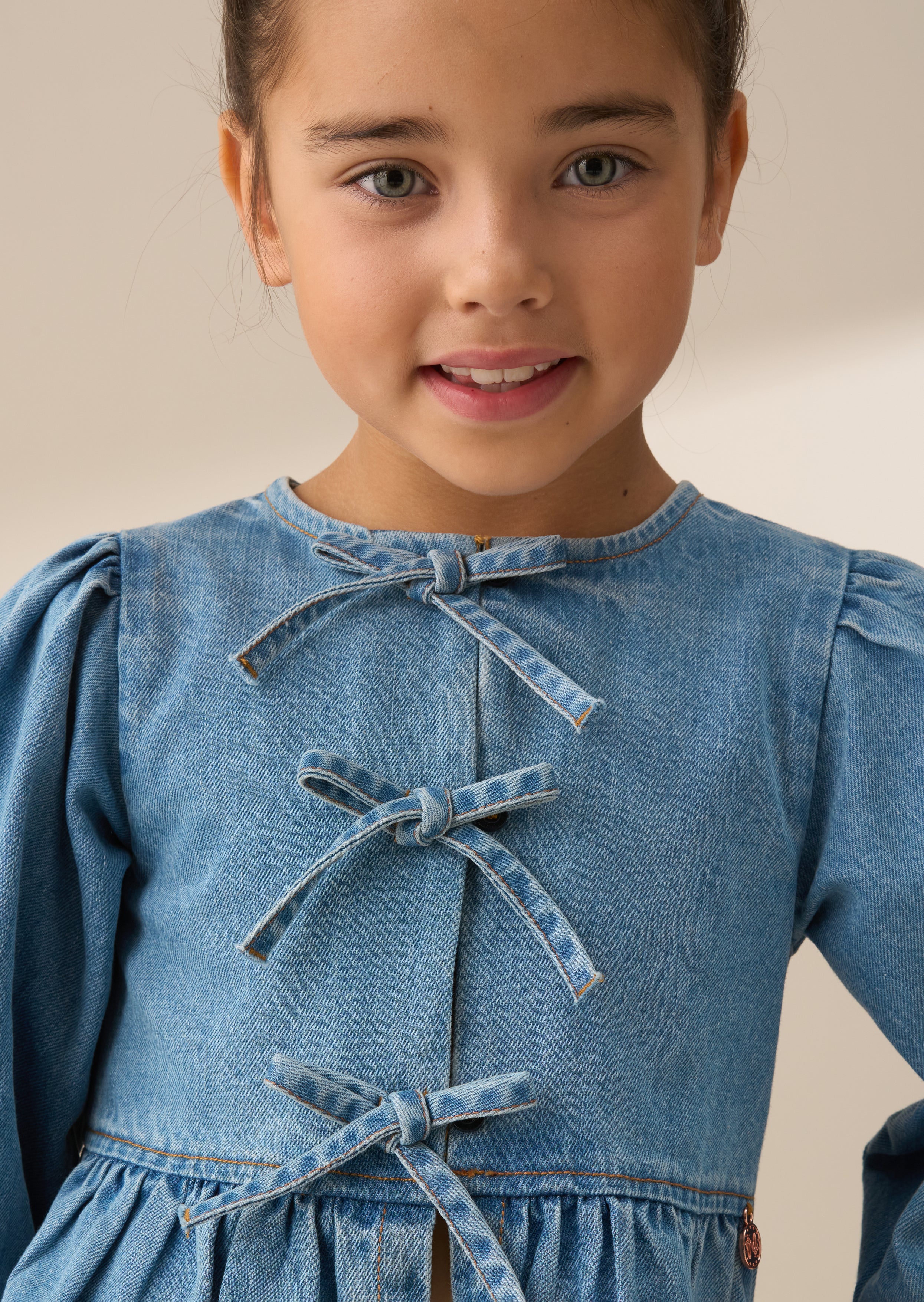 Top de lazo peplum de mezclilla azul Rochelle