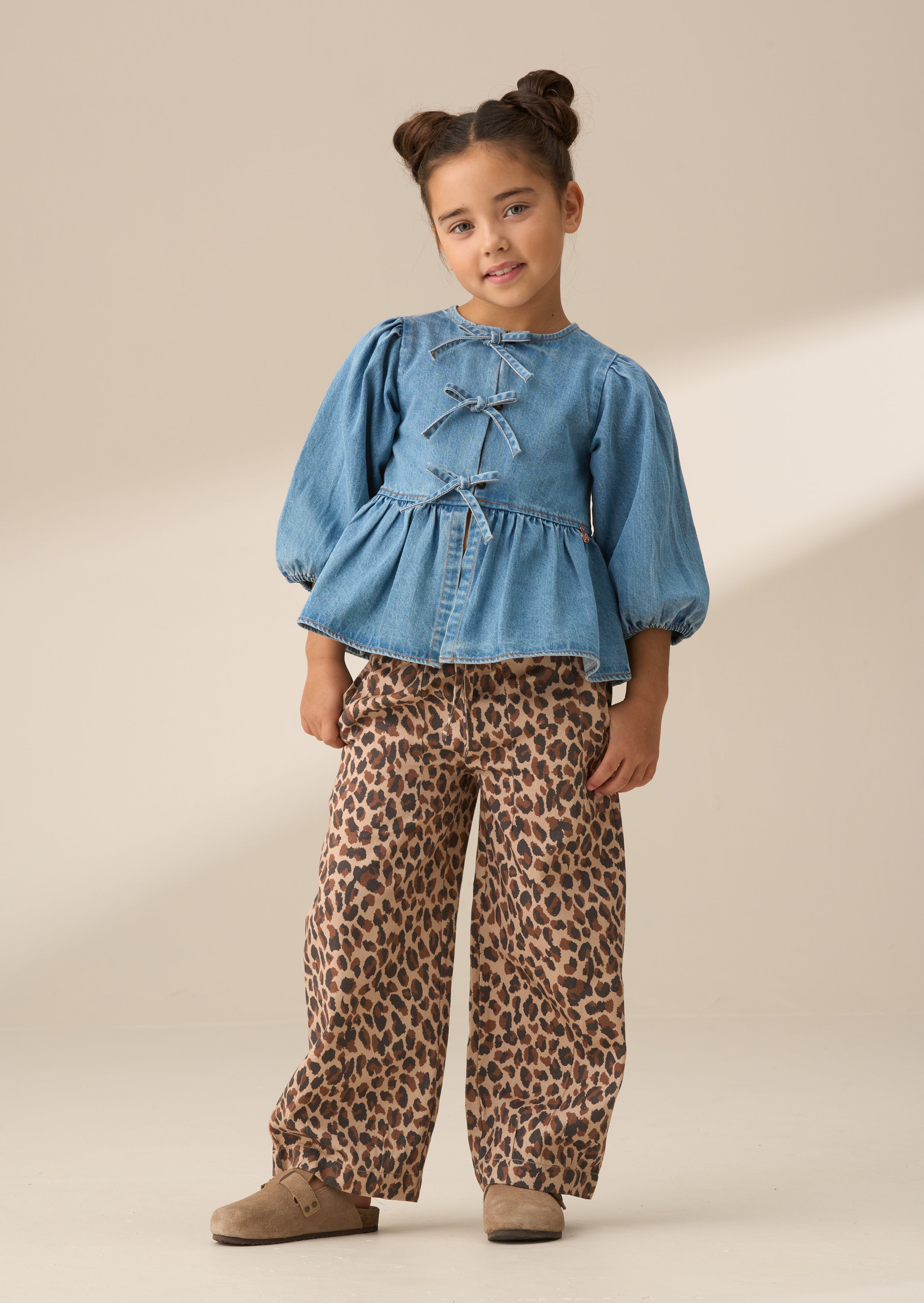 Top de lazo peplum de mezclilla azul Rochelle