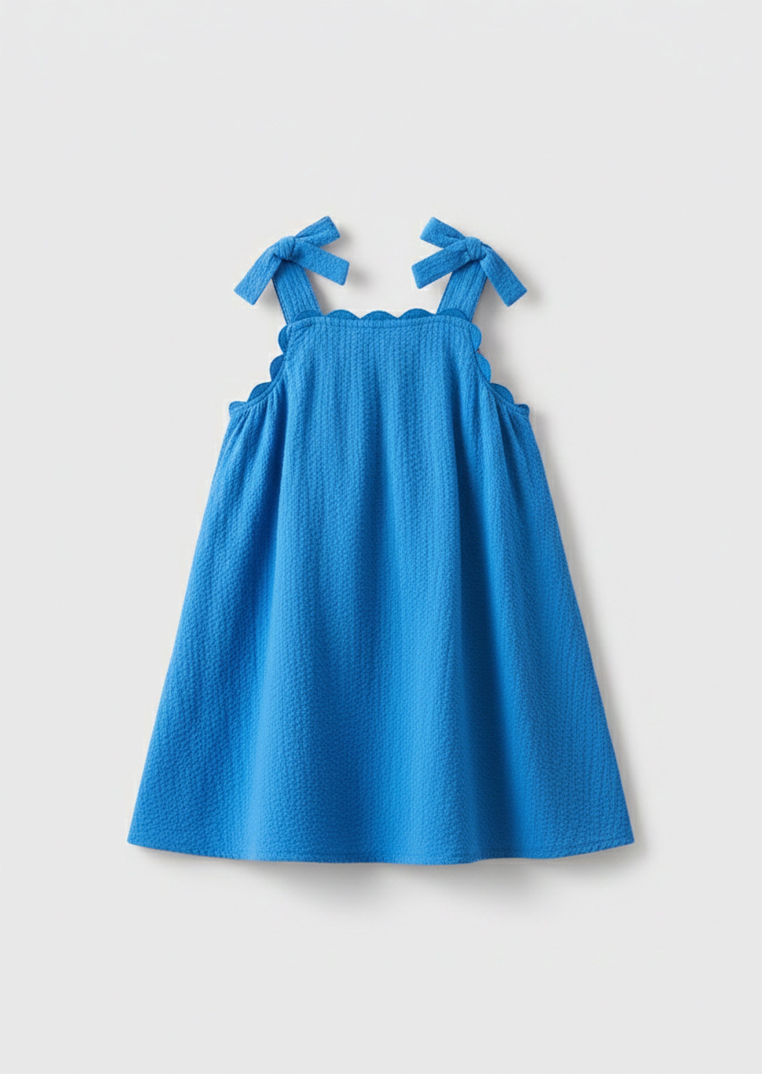 فستان ماتيلدا أزرق بحافة متموجة وعقدة