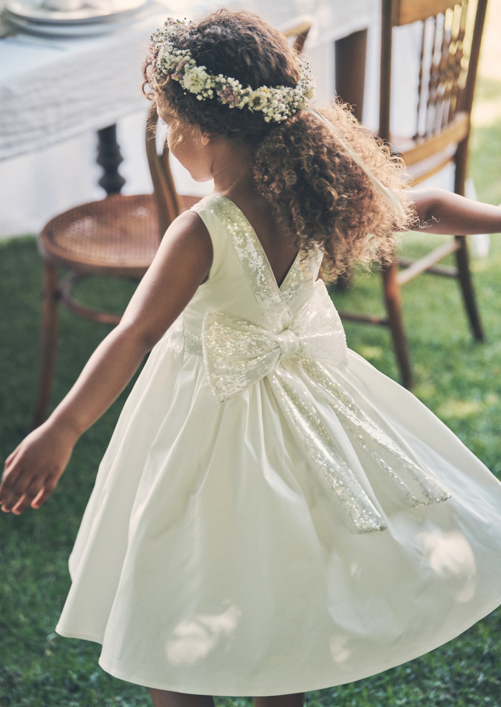 Vestito Claudia avorio con fiocco di paillettes