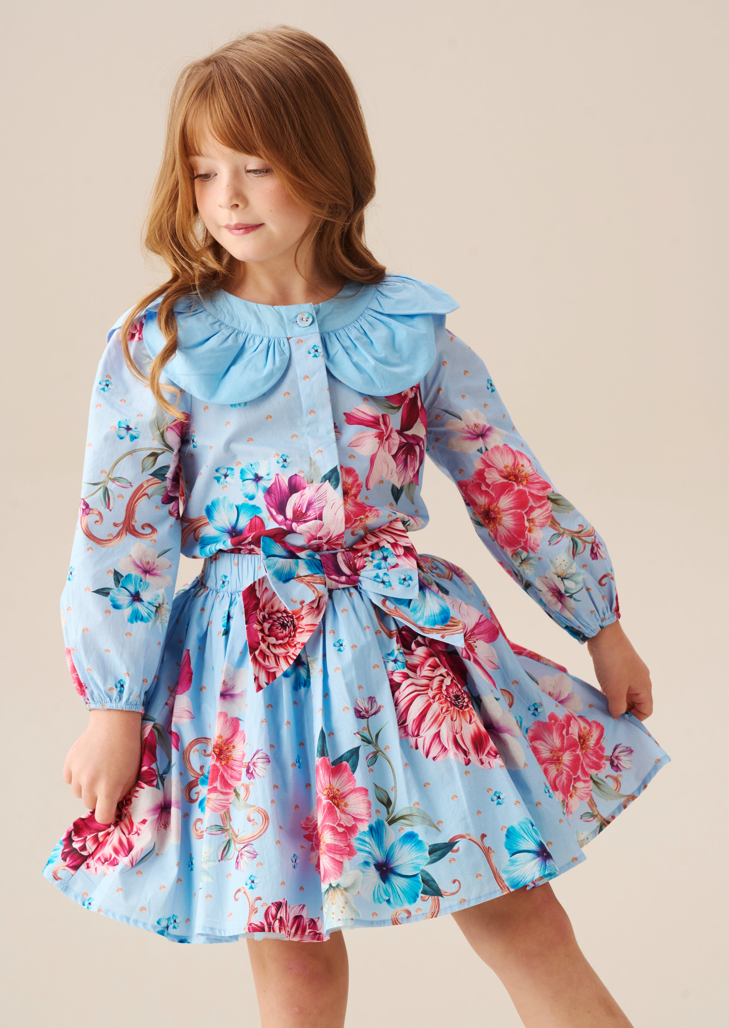 تنورة دارسي بلو برينت بقوس عند الخصر