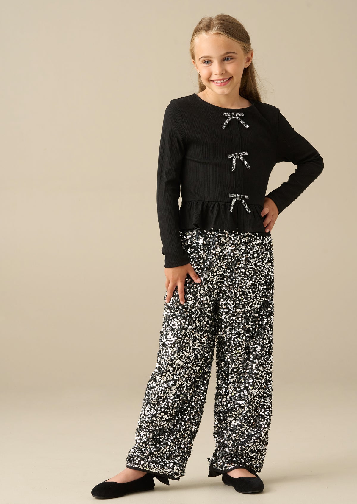 Rona Black Peplum Long Sleeve Bow Top