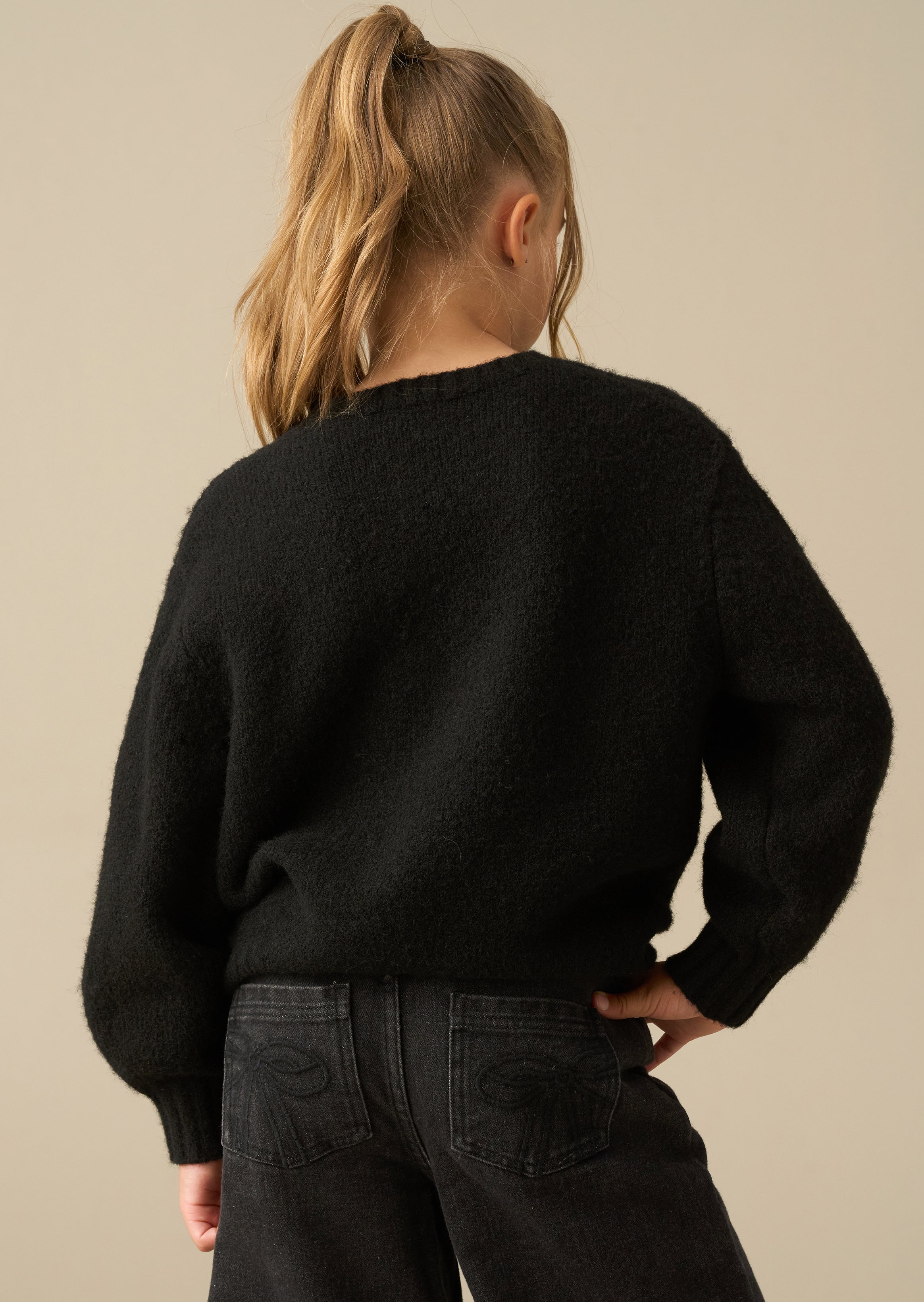 Maglione Mya nero con fiocchi decorativi