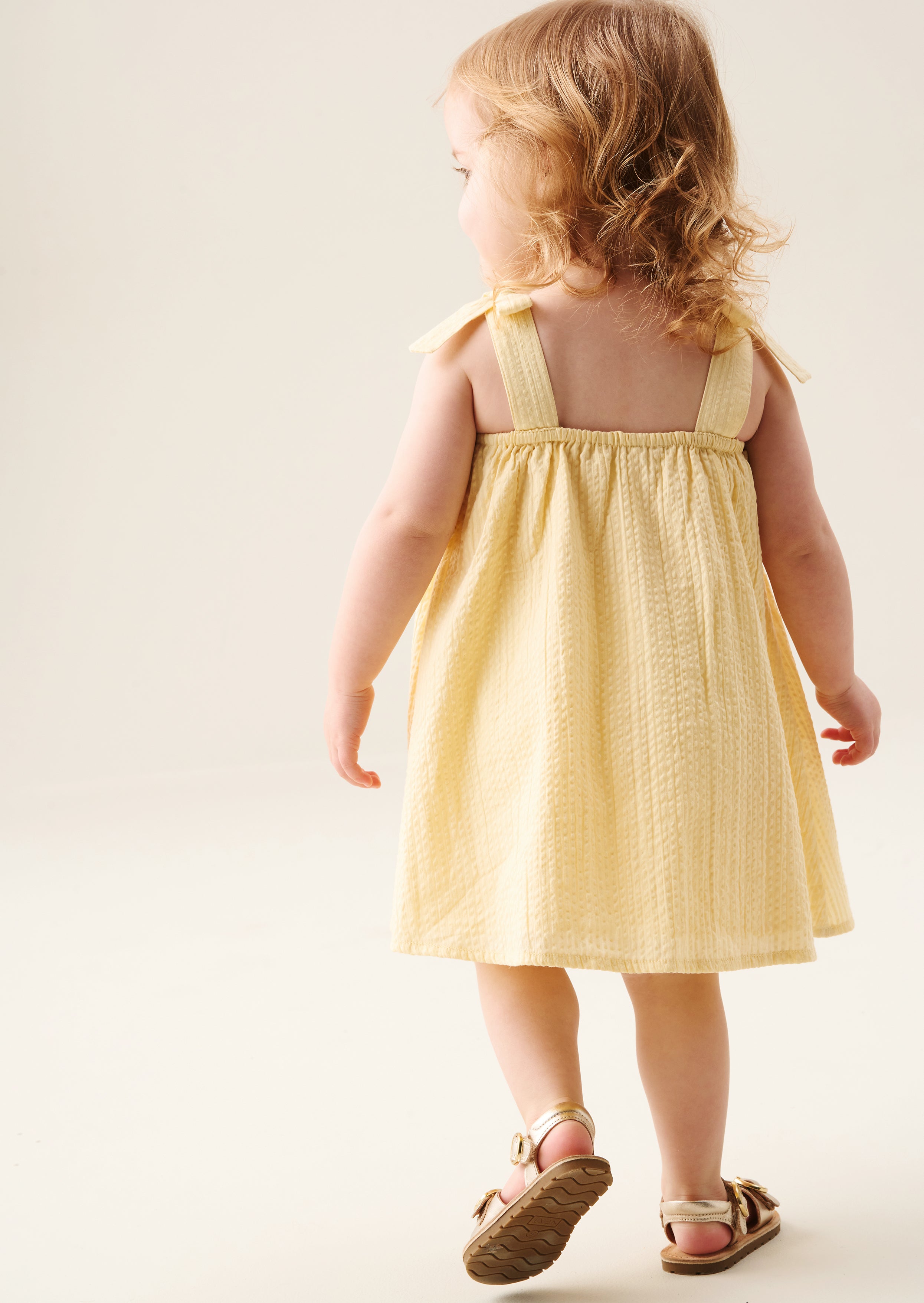 Robe Matilda jaune à nœud festonné